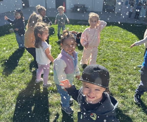 Children playing with bubbles